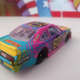 The “RFR DRIVEN” logos are completely made up for the diecast. These never appeared. But why sell a diecast with blank space on it where you could plug your team instead?